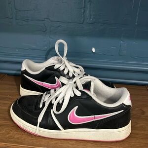 Old pink and black Nike air sneakers. Size 6 women’s.